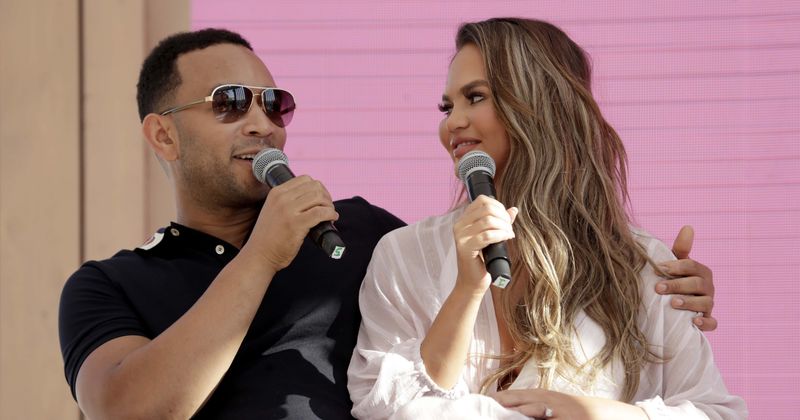 Chrissy Teigen and John Legend brag about matching tattoos in their signature "wild" and "crazy" style