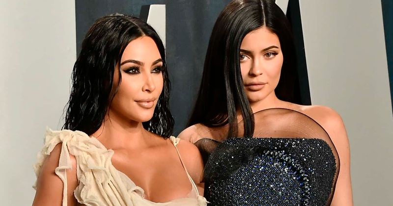 Kim Kardashian and Kylie Jenner show off their curves in racy bikinis during poolside family outing
