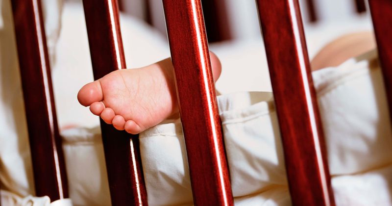 Michigan man grabs 8-month-old by leg and smashes him against table, mother goes for a smoke while child dies