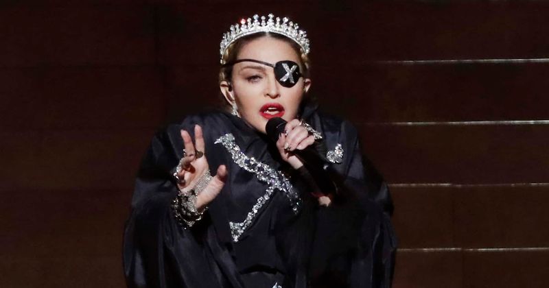 MADGE AS A HATTER: Madonna claims she's ready 'to breathe in COVID-19 air' because she has antibodies