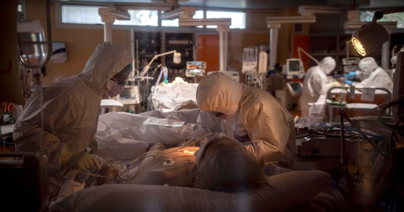 Florida man who called Covid-19 a hoax tests positive, says he infected wife who's now fighting for life in ICU