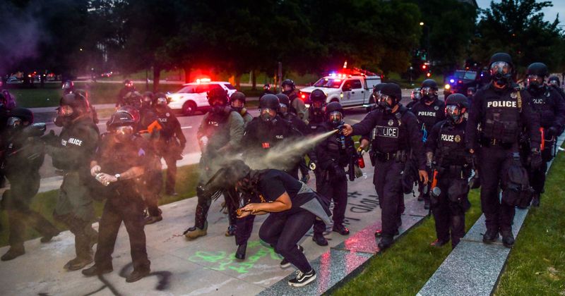 California man who teaches police recruits about bias shot in groin with riot gun during protest