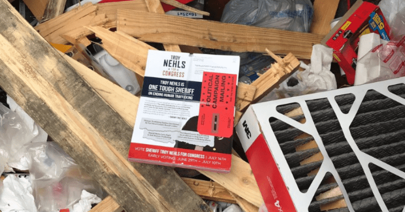 USPS worker allegedly threw Texas sheriff's GOP campaign fliers in dumpster, shocking video shows