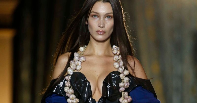 Bella Hadid strips down to tiny red G-string by poolside hours before going braless in sheer top in sultry pics