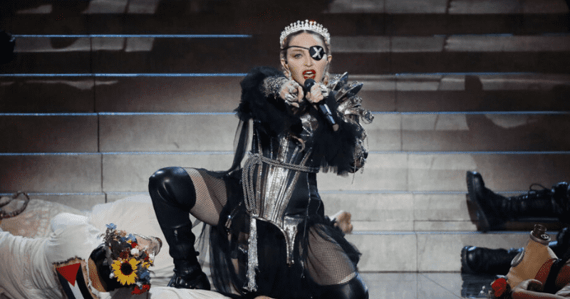 Madonna bares it all in raunchy topless mirror selfie while leaning on crutch post-knee injury