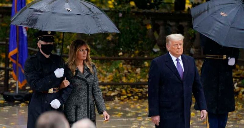 Who is the masked soldier Melania Trump holds on to? Conspiracy theories run riot as she stands away from POTUS