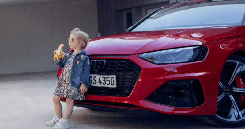Audi pulls 'suggestive' ad showing girl eating a banana in front of car amid outrage: 'We care for children'