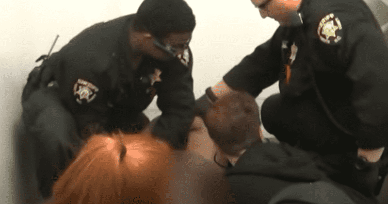 Black inmate John Neville dies shouting 'I can't breathe' over 20 times as prison guards hog-tie him to chair