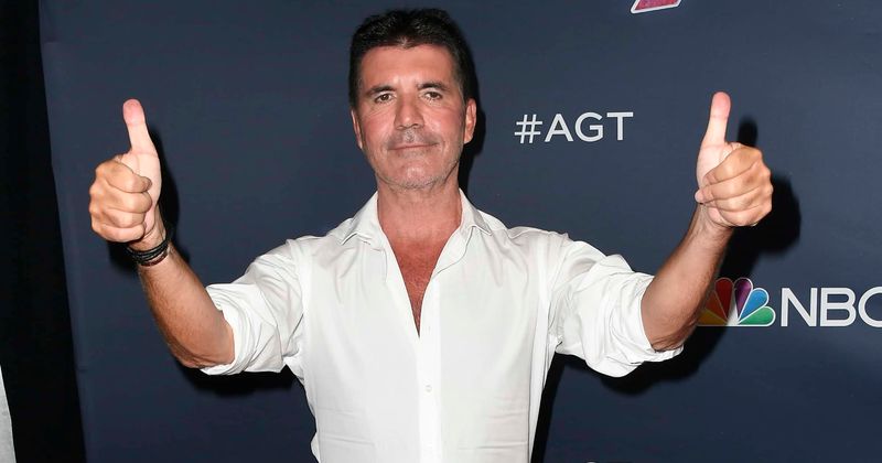 Simon Cowell 'walking and moving around' faster than predicted a week after breaking his back in bike accident