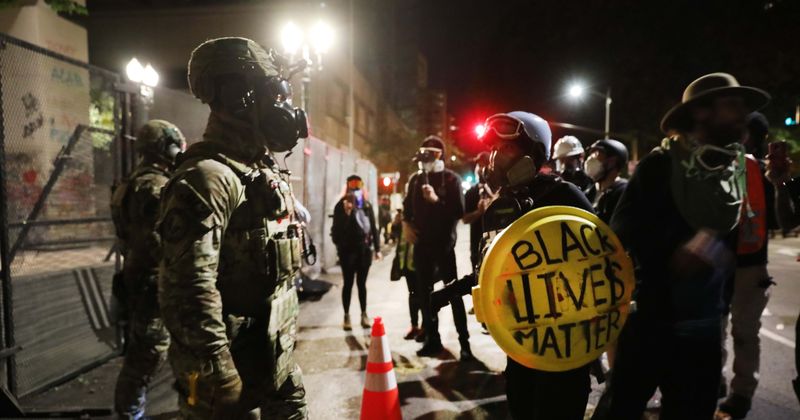 Police declare Portland rally a 'riot' after protesters hurl Molotov cocktails, dramatic video shows man on fire