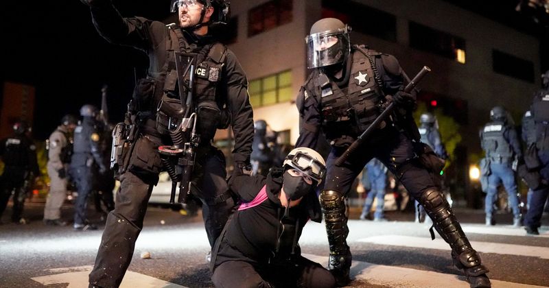 Portland police pin down delivery man not part of protests, Internet says cops 'absolutely out of control'