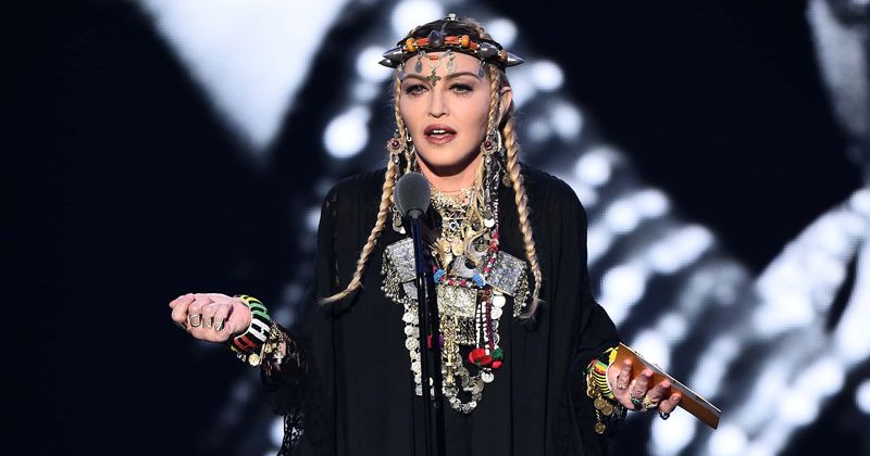 Madonna's boyfriend Ahlamalik Williams, 26, kisses her while pushing her against fence in steamy photoshoot