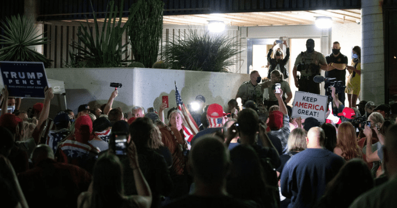 Armed Trump supporters force Arizona election centre to shut down as they gather outside screaming 'Stop the count'
