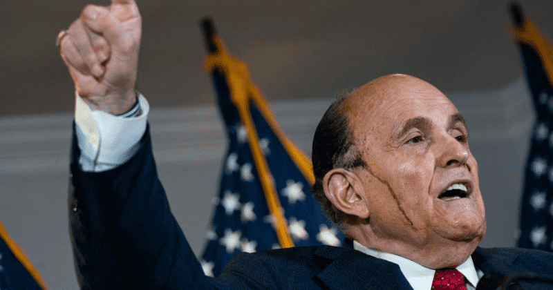Rudy Giuliani jokes dark brown gunk dripping from head were 'brains', says he used a 'rag' to stuff it all back