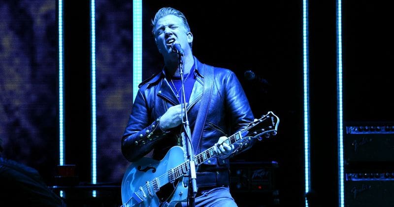 Queens of the Stone Age frontman Josh Homme kicks female photographer in the head during show