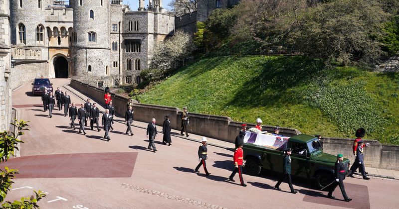 Prince Philip funeral: TOPLESS woman arrested after she yells ‘save planet’ and jumps on Queen Victoria's statue