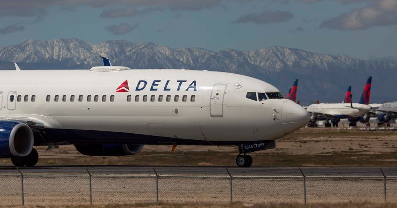 Shocking video shows Delta passenger trying to open aircraft door mid-air
