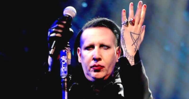 Will Marilyn Manson be jailed for snot rocket assault? Singer surrenders to LA cops
