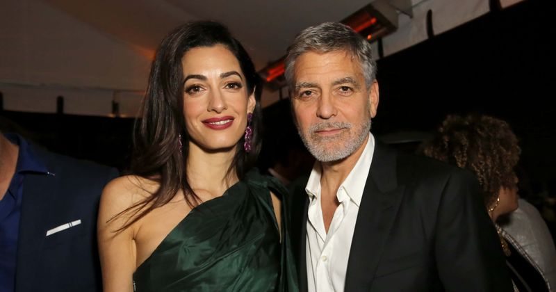 Amal Clooney stuns in sunny orange jumpsuit as she and George Clooney take twins to lunch