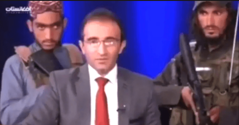 Terrified Afghan news presenter flanked by armed Taliban asked to praise group live on air