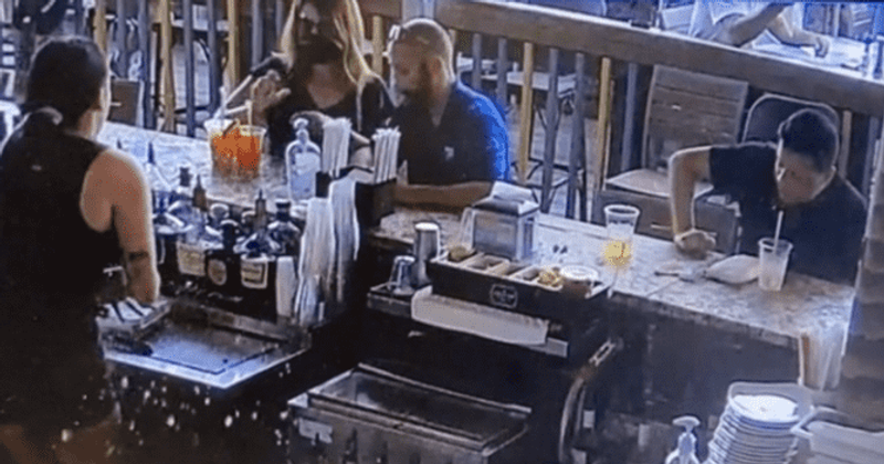 Viral video shows Florida 'Karen' throwing drink at bartender after finding bug in it